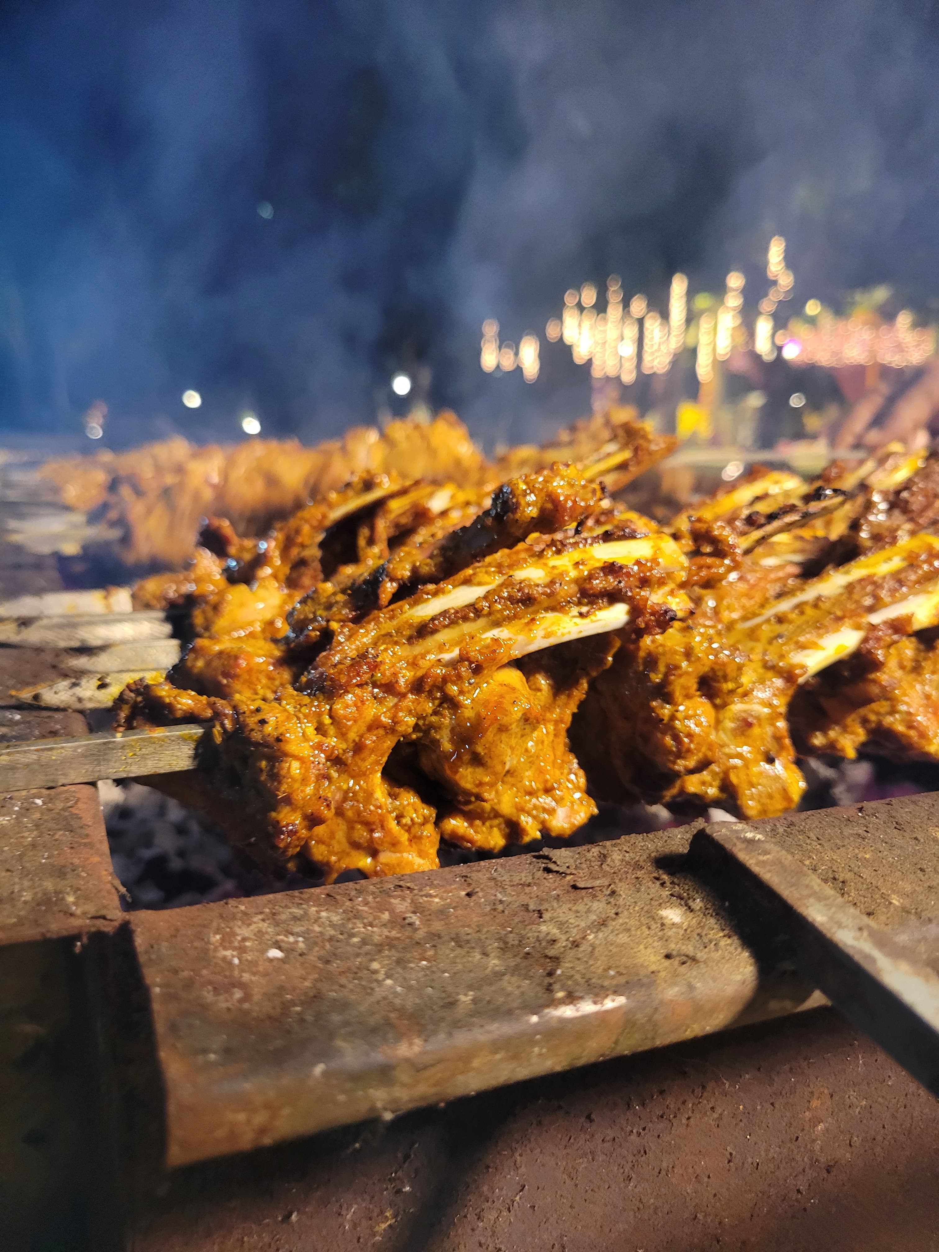 Live grilled chops at a Red Table catering event in Lahore